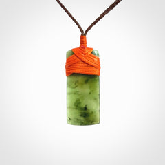 Unique small Jade Toki hand carved here in New Zealand, the cord is adjustable.