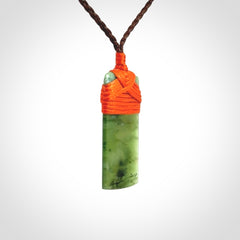 Unique small Jade Toki hand carved here in New Zealand, the cord is adjustable.