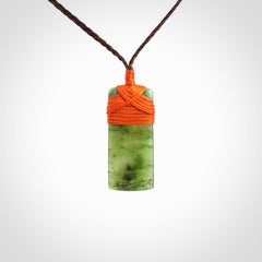 Unique small Jade Toki hand carved here in New Zealand, the cord is adjustable.
