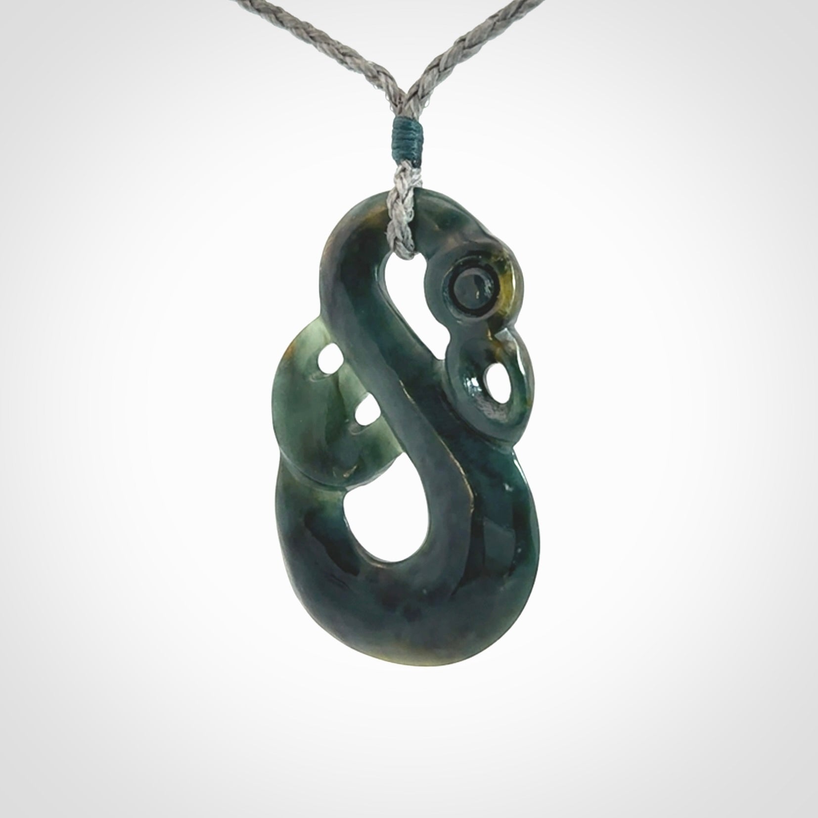 Hand carved Guatemalan Jadeite Manaia Pendant