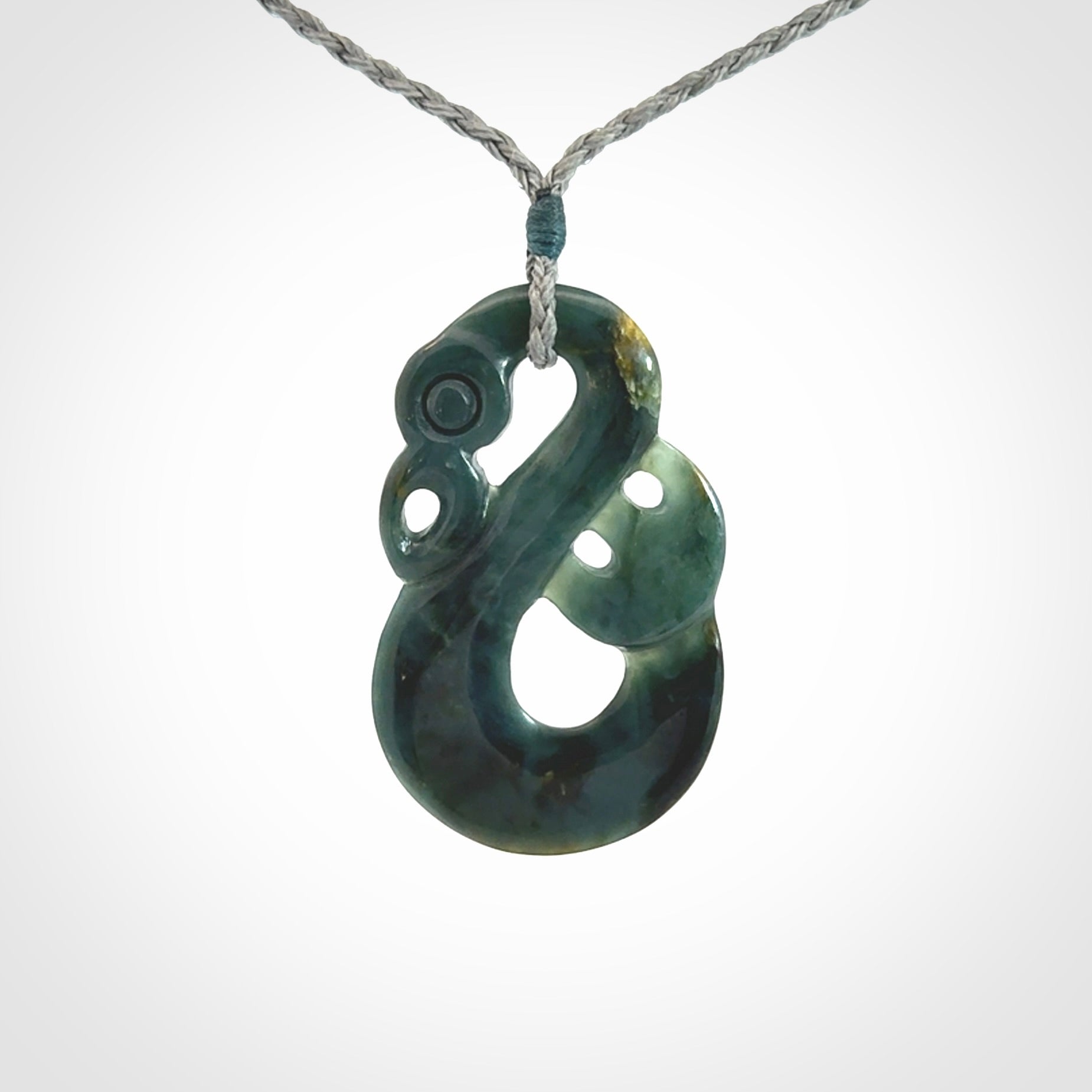 Hand carved Guatemalan Jadeite Manaia Pendant