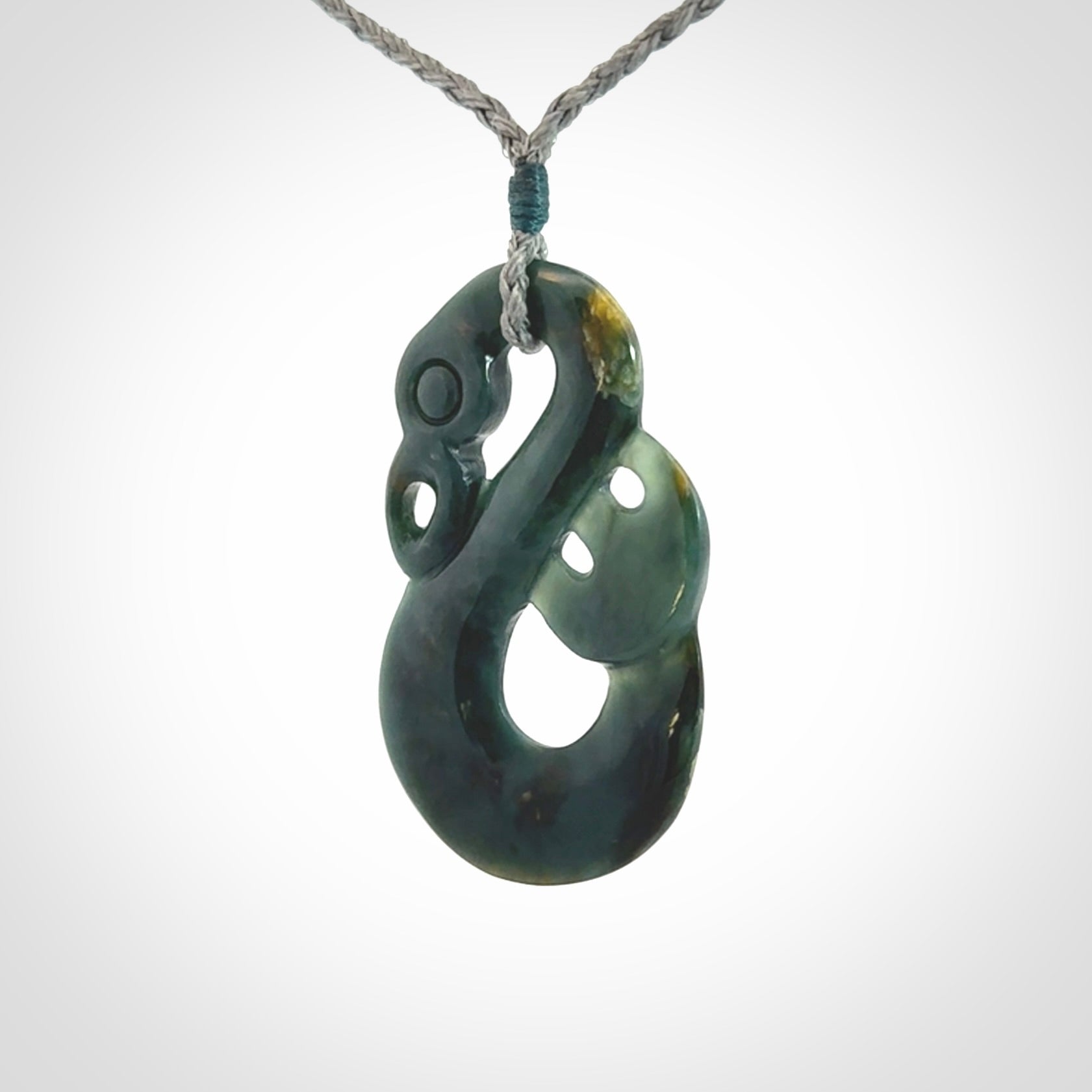 Hand carved Guatemalan Jadeite Manaia Pendant