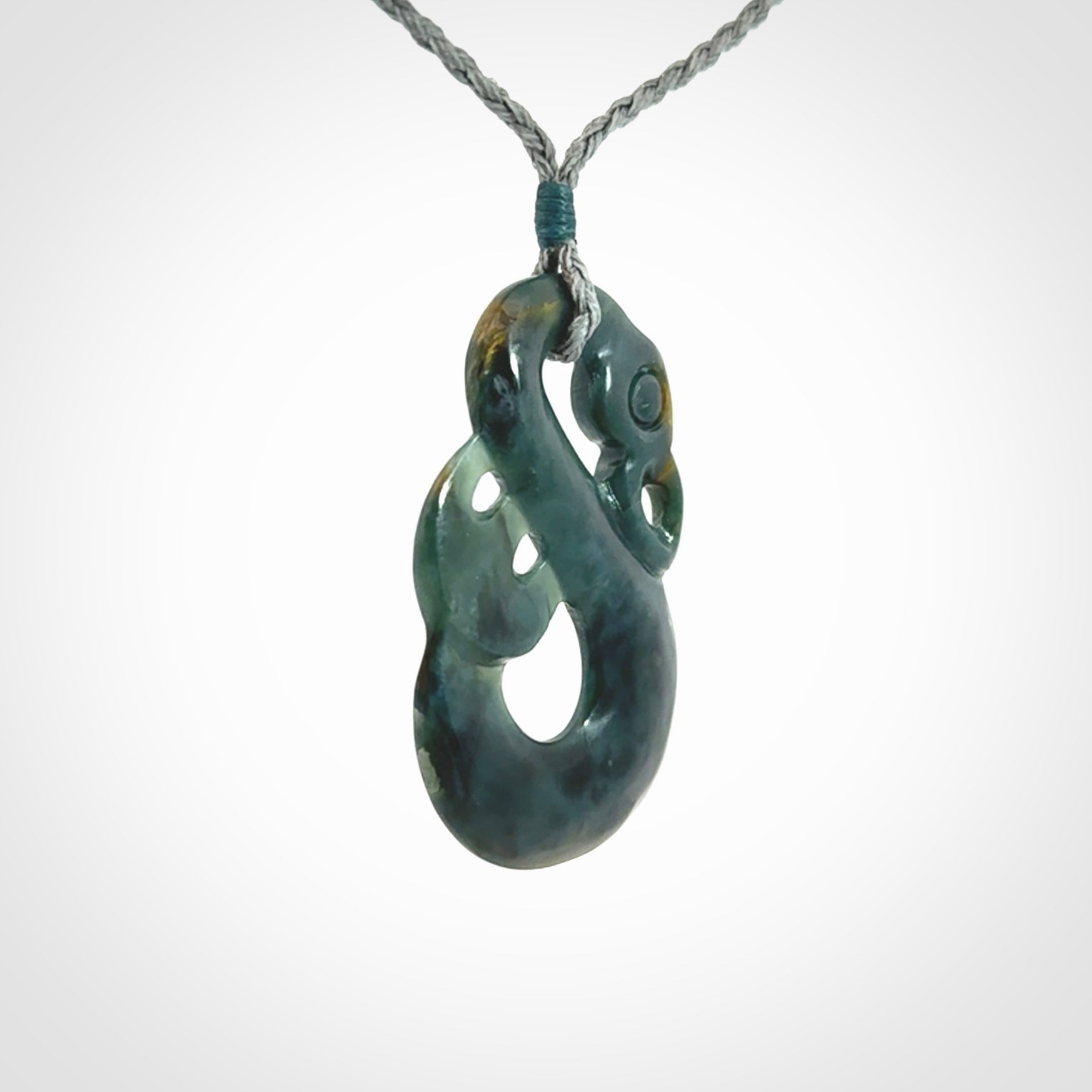 Hand carved Guatemalan Jadeite Manaia Pendant