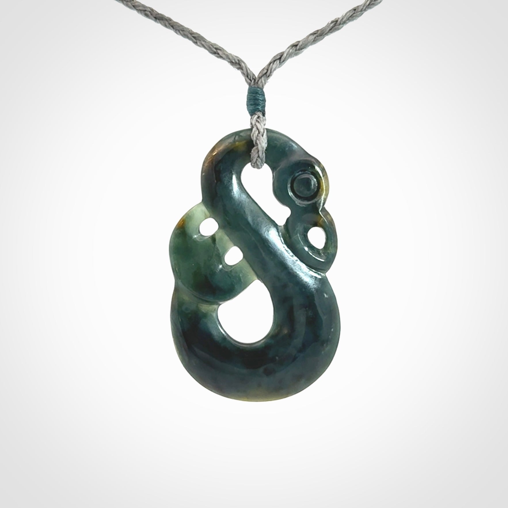 Hand carved Guatemalan Jadeite Manaia Pendant