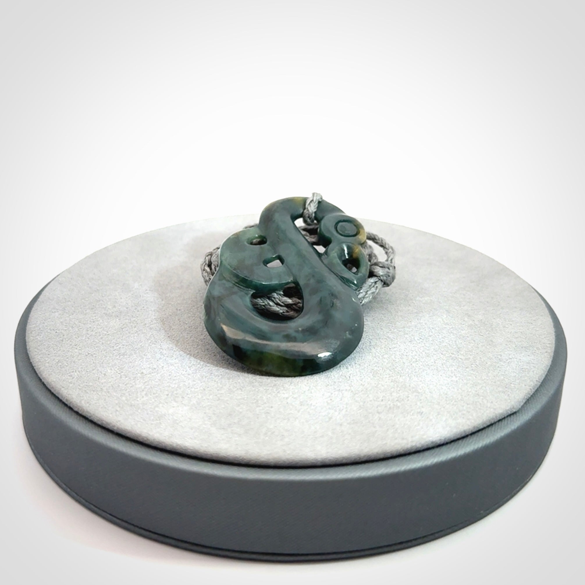 Hand carved Guatemalan Jadeite Manaia Pendant
