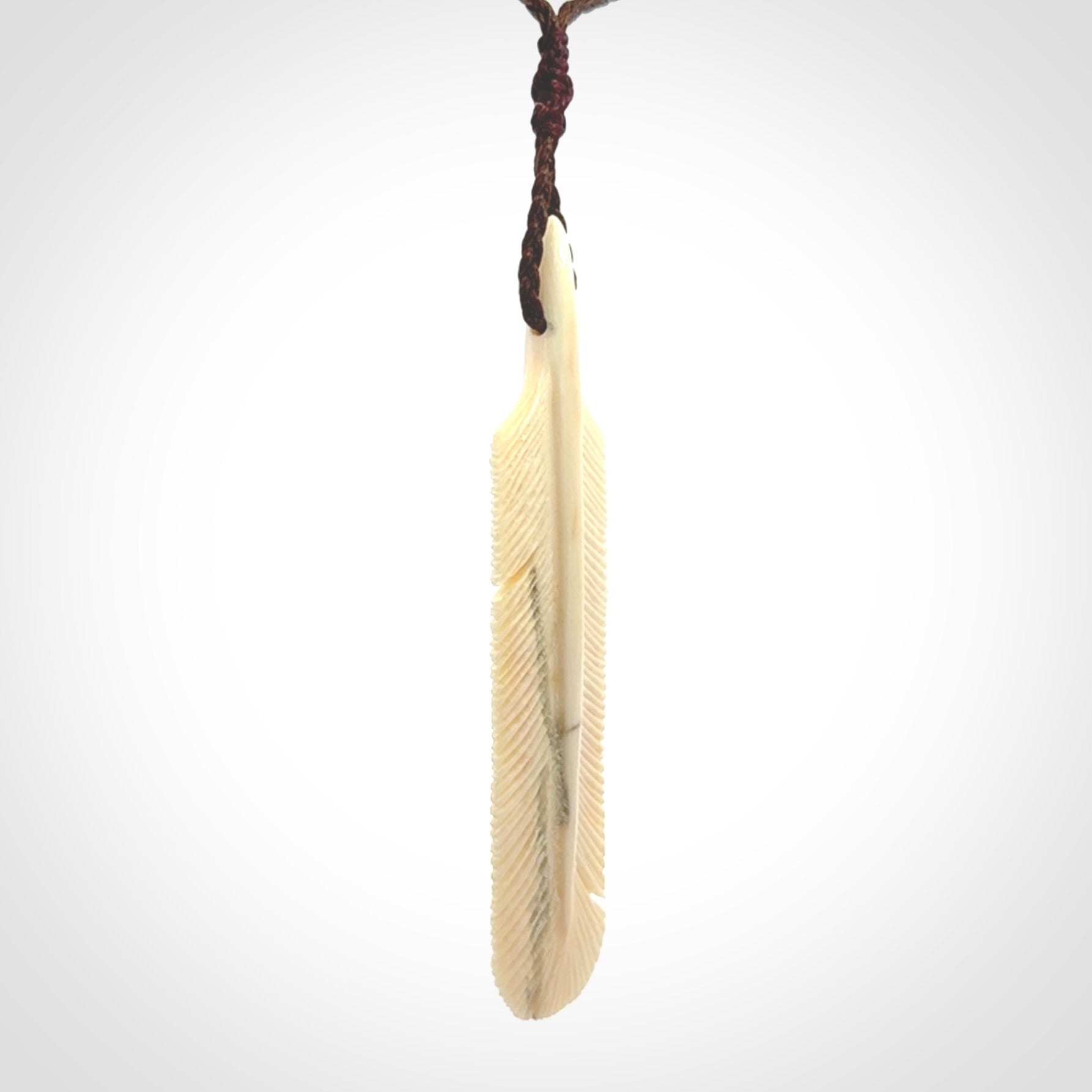 Hand carved Woolly Mammoth Tusk feather pendant. Art to Wear. Provided with adjustable cord.