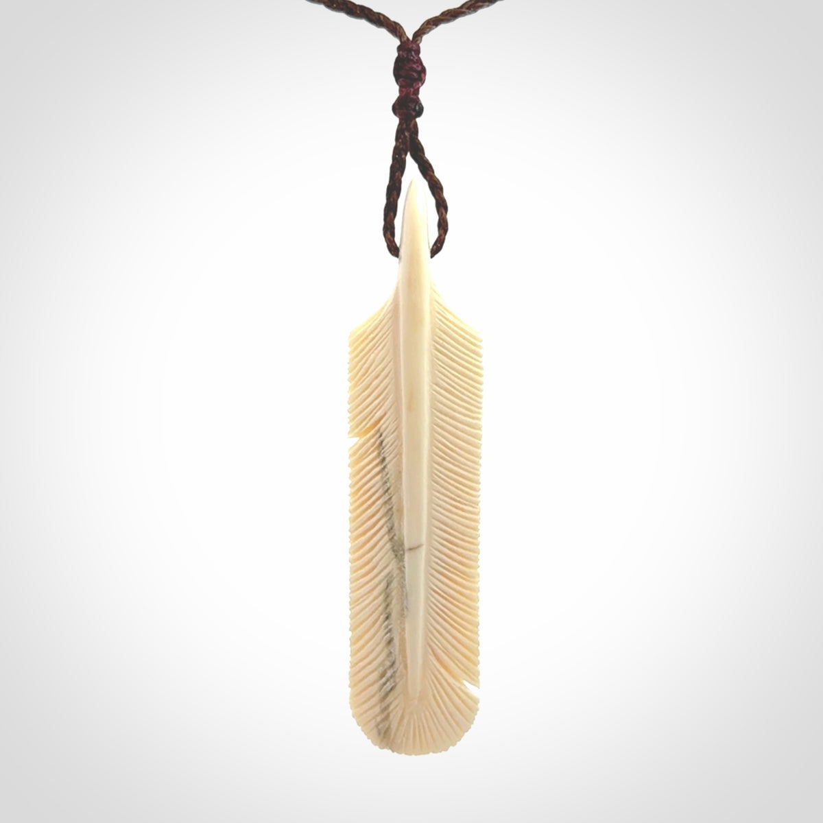 Hand carved Woolly Mammoth Tusk feather pendant. Art to Wear. Provided with adjustable cord.