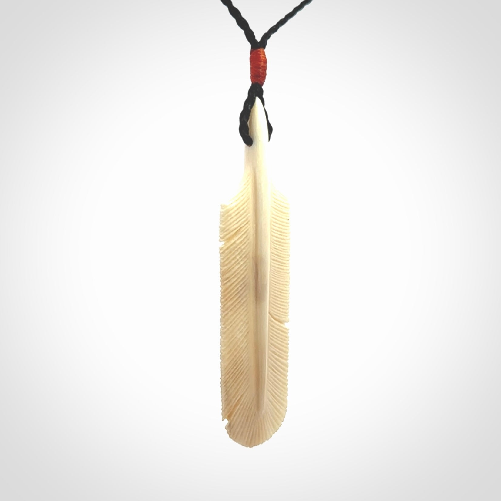Hand carved Woolly Mammoth Tusk feather pendant. Art to Wear. Provided with adjustable cord.