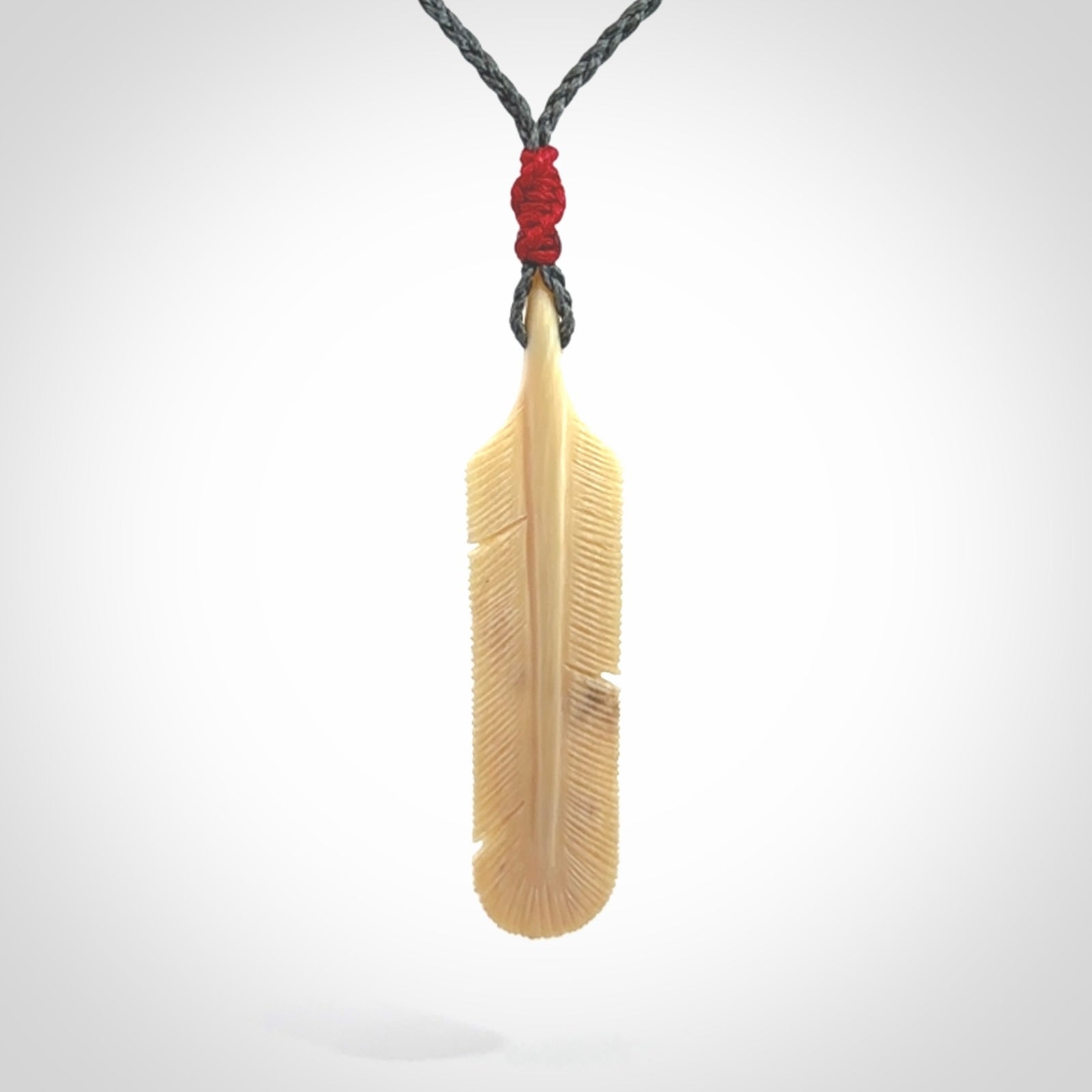 Hand carved Woolly Mammoth Tusk feather pendant. Art to Wear. Provided with adjustable cord.
