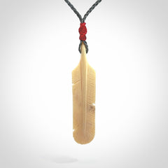 Hand carved Woolly Mammoth Tusk feather pendant. Art to Wear. Provided with adjustable cord.