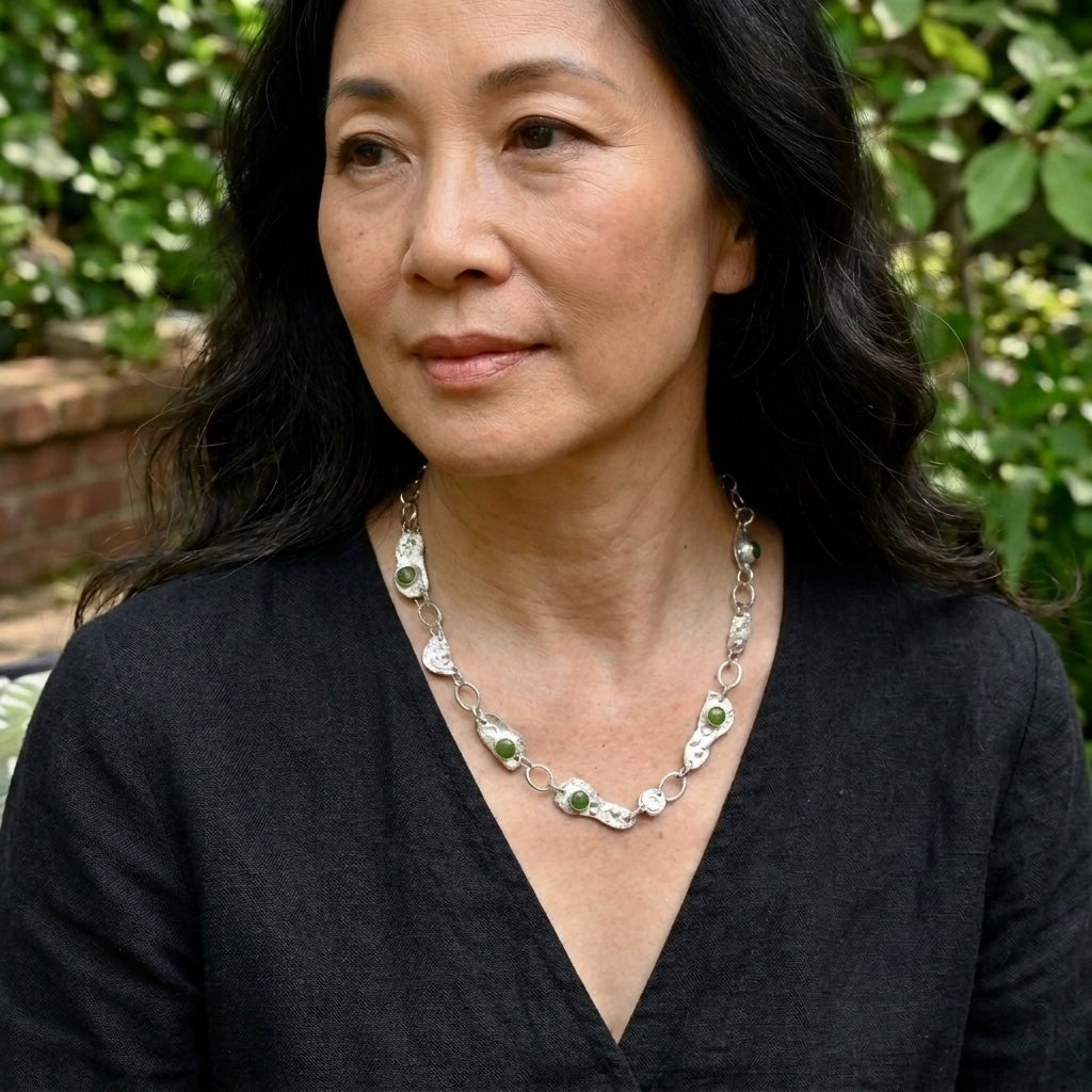 Woman wearing jade and silver necklace
