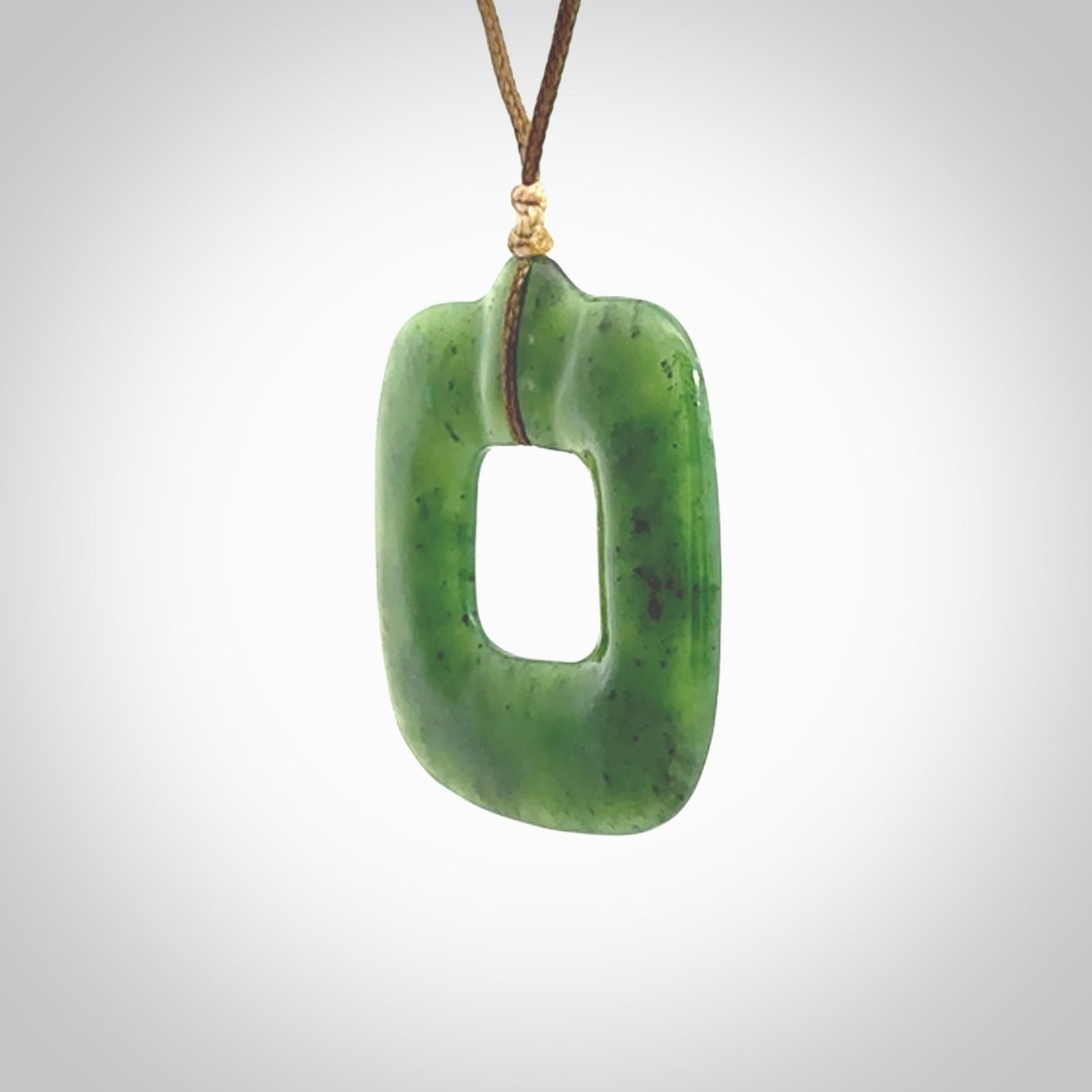 Hand carved British Columbian jade pendant. Carved by NZ Pacific from British Columbian jade. This is a modern, contemporary pendant made from natural materials.