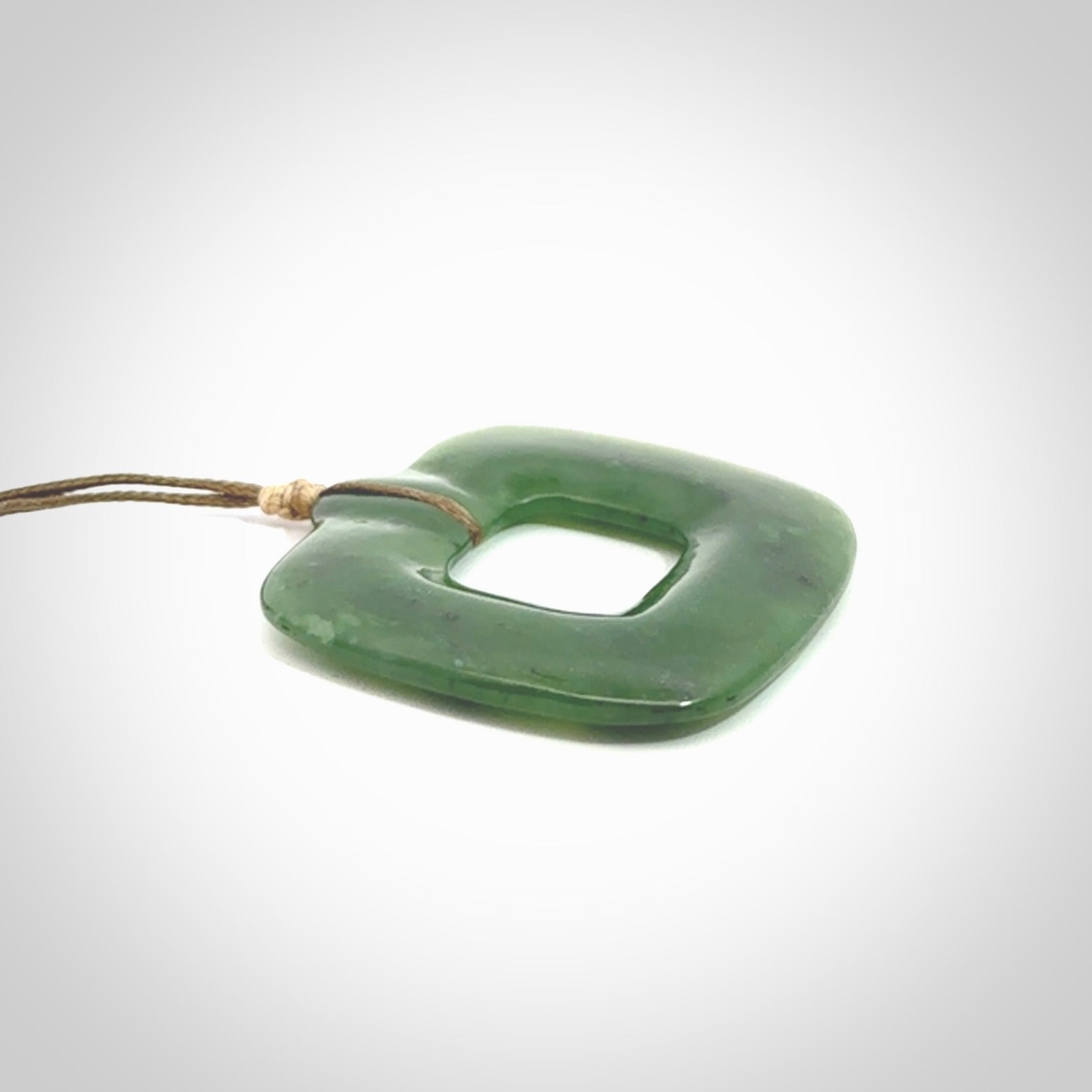 Hand carved British Columbian jade pendant. Carved by NZ Pacific from British Columbian jade. This is a modern, contemporary pendant made from natural materials.