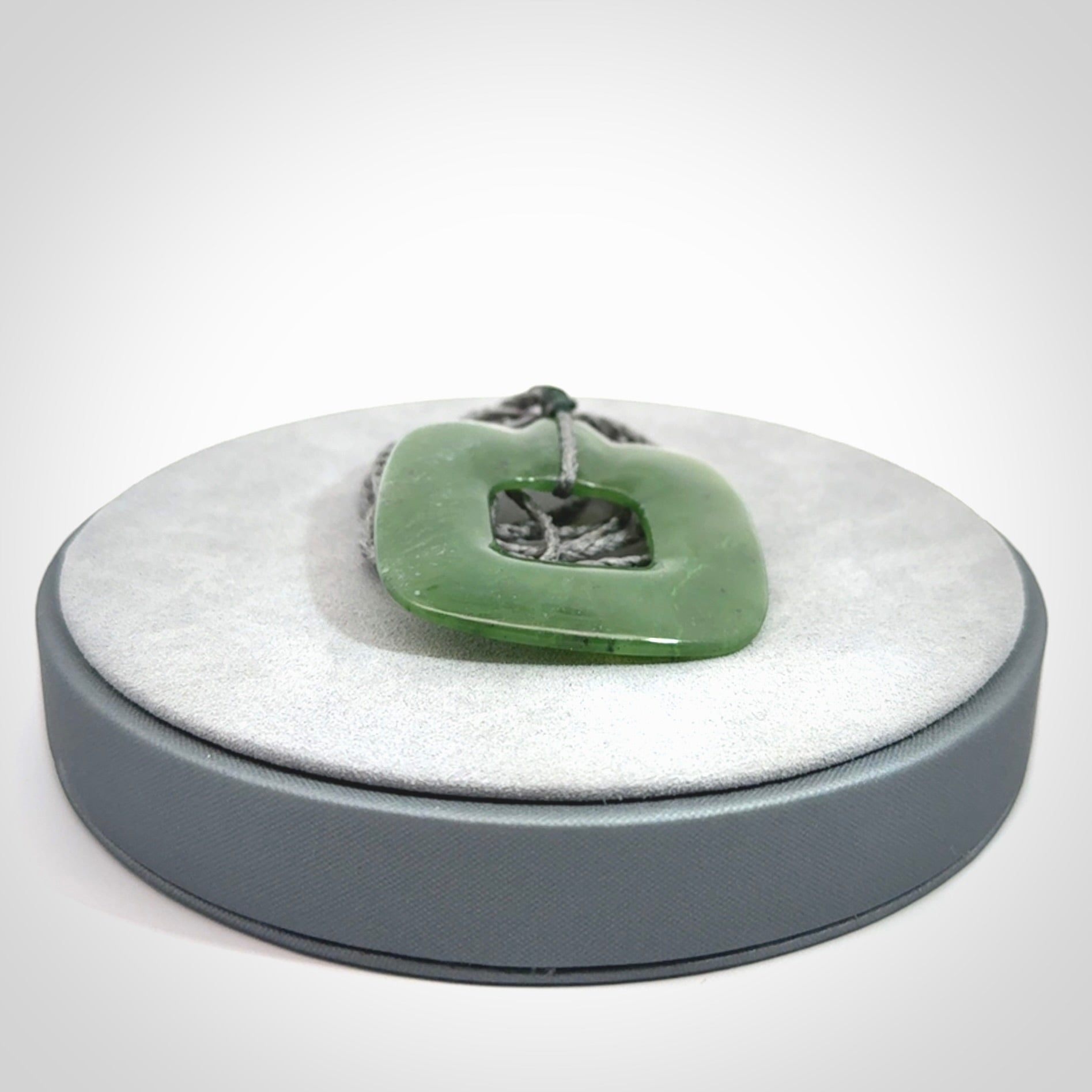Hand carved British Columbian jade pendant. Carved by NZ Pacific from British Columbian jade. This is a modern, contemporary pendant made from natural materials.
