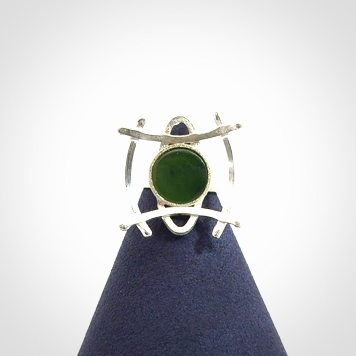 This is a handcrafted New Zealand Pounamu, Jade and sterling silver ring.