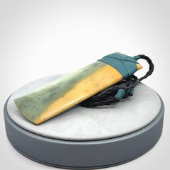 This is a lovely, one-off large, green toki pendant we've made from a gorgeous New Zealand jade. It is finished in a matte sheen and is bound with our plaited cord. These are wonderful pieces that are very attractive and will last a lifetime.