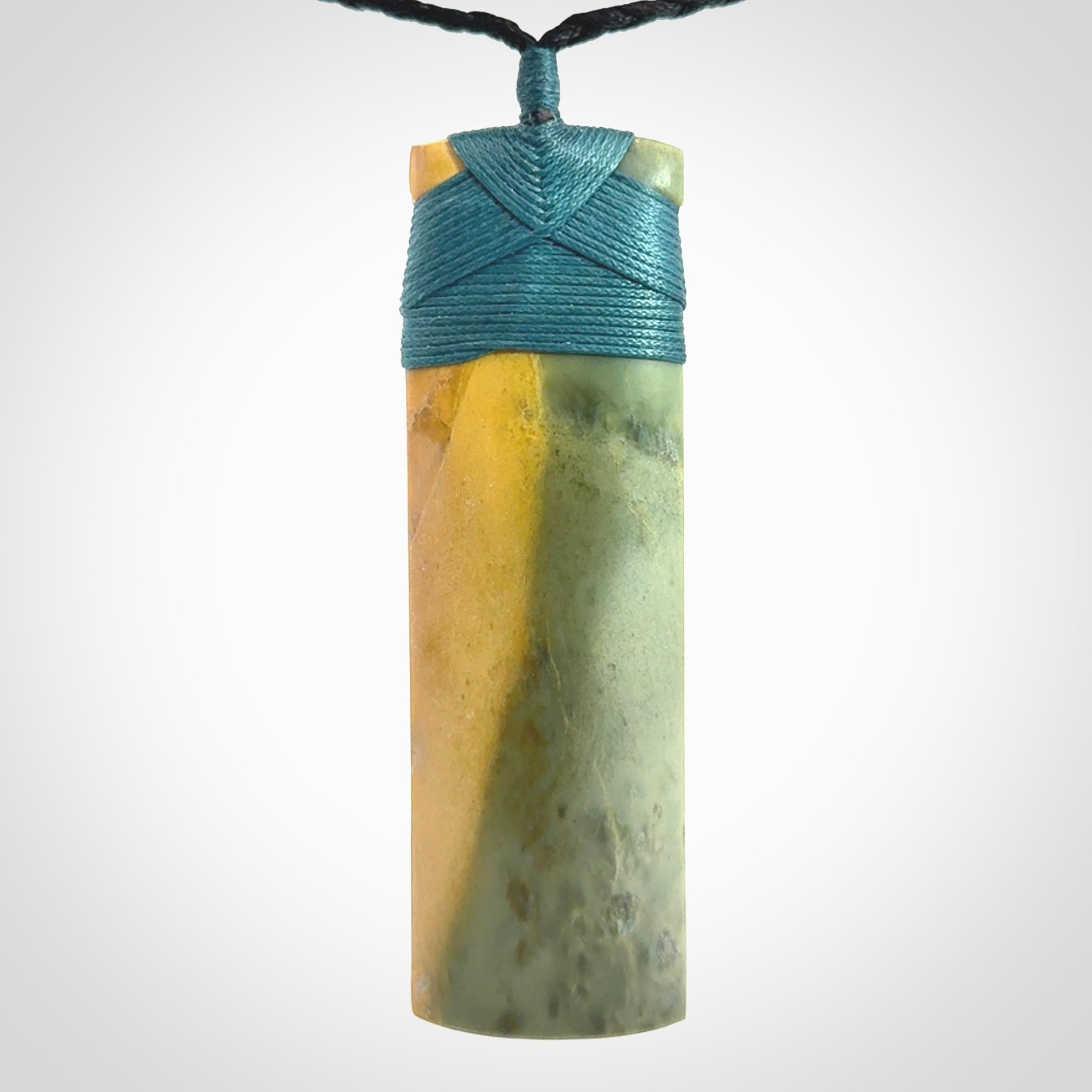 This is a lovely, one-off large, green toki pendant we've made from a gorgeous New Zealand jade. It is finished in a matte sheen and is bound with our plaited cord. These are wonderful pieces that are very attractive and will last a lifetime.