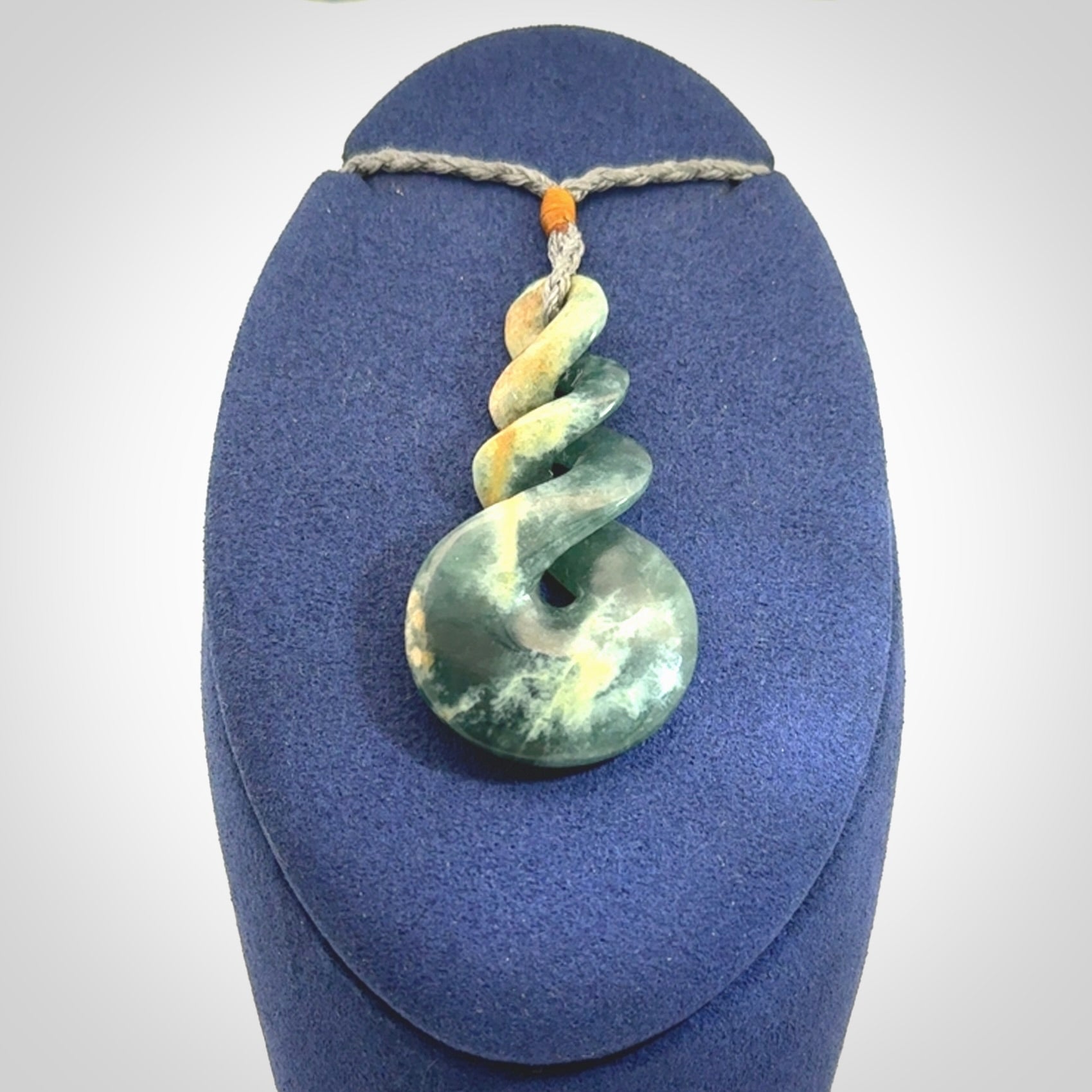 This is a hand carved triple twist pendant. Graeme carved this from Guatemalan Jadeite. It is a gorgeous blue colour and is an artistic piece of jewellery. Hand made by Graeme Wylie and delivered to you in a kete pouch.