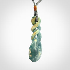 This is a hand carved triple twist pendant. Graeme carved this from Guatemalan Jadeite. It is a gorgeous blue colour and is an artistic piece of jewellery. Hand made by Graeme Wylie and delivered to you in a kete pouch.