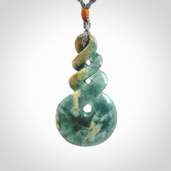 This is a hand carved triple twist pendant. Graeme carved this from Guatemalan Jadeite. It is a gorgeous blue colour and is an artistic piece of jewellery. Hand made by Graeme Wylie and delivered to you in a kete pouch.