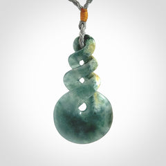 This is a hand carved triple twist pendant. Graeme carved this from Guatemalan Jadeite. It is a gorgeous blue colour and is an artistic piece of jewellery. Hand made by Graeme Wylie and delivered to you in a kete pouch.
