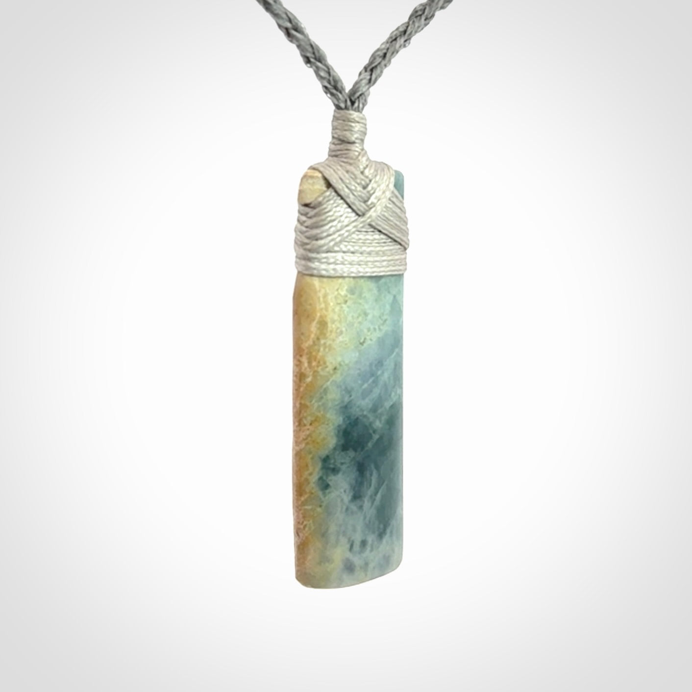 This is a hand carved toki pendant. Graeme carved this from Guatemalan Jadeite. It is a gorgeous blue colour and is an artistic piece of jewellery. Hand made by Graeme Wylie and delivered to you in a kete pouch.