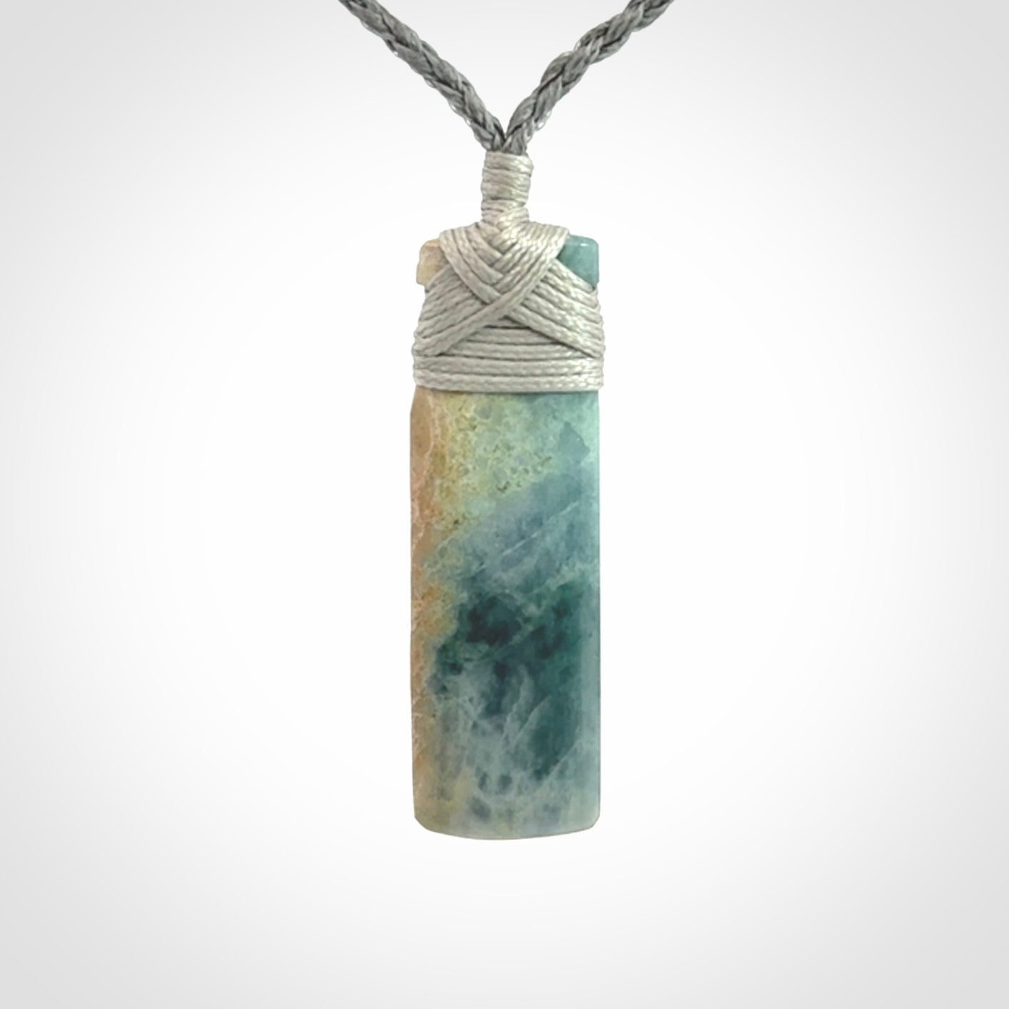 This is a hand carved toki pendant. Graeme carved this from Guatemalan Jadeite. It is a gorgeous blue colour and is an artistic piece of jewellery. Hand made by Graeme Wylie and delivered to you in a kete pouch.