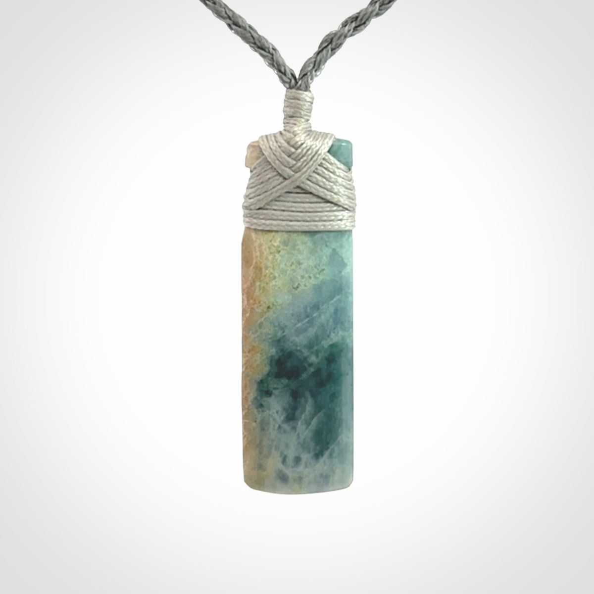 This is a hand carved toki pendant. Graeme carved this from Guatemalan Jadeite. It is a gorgeous blue colour and is an artistic piece of jewellery. Hand made by Graeme Wylie and delivered to you in a kete pouch.