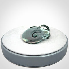 Guatemalan Jadeite Koru Manaia pendant. Made in New Zealand. Real Jade, pounamu. Real New Zealand Jade Manaia with Koru necklace with a polished finish.