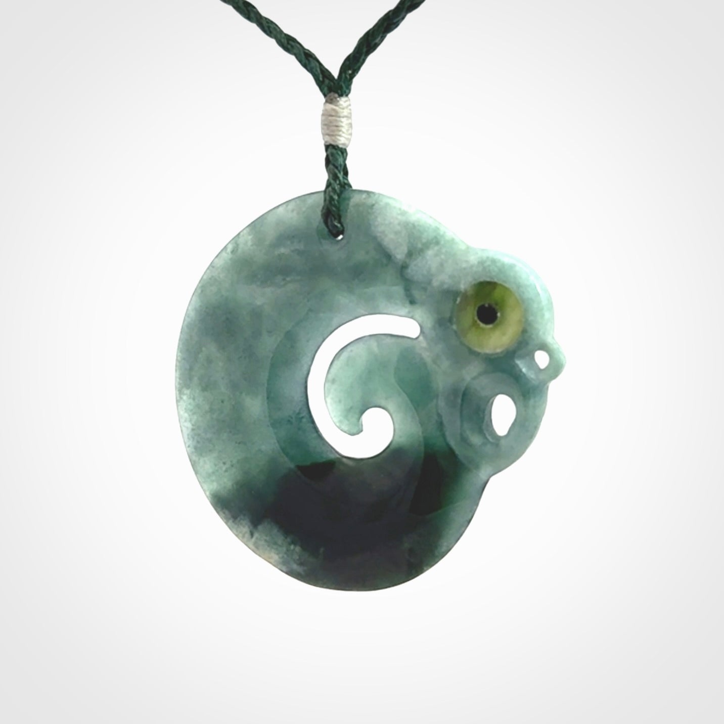 Guatemalan Jadeite Koru Manaia pendant. Made in New Zealand. Real Jade, pounamu. Real New Zealand Jade Manaia with Koru necklace with a polished finish.