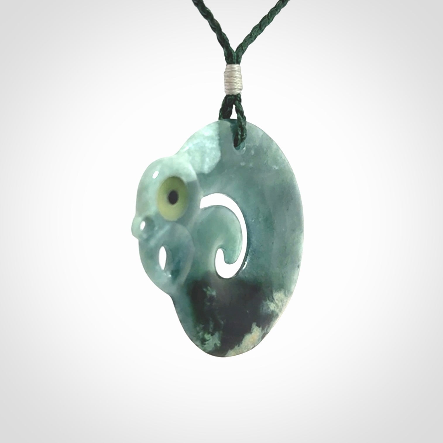 Guatemalan Jadeite Koru Manaia pendant. Made in New Zealand. Real Jade, pounamu. Real New Zealand Jade Manaia with Koru necklace with a polished finish.