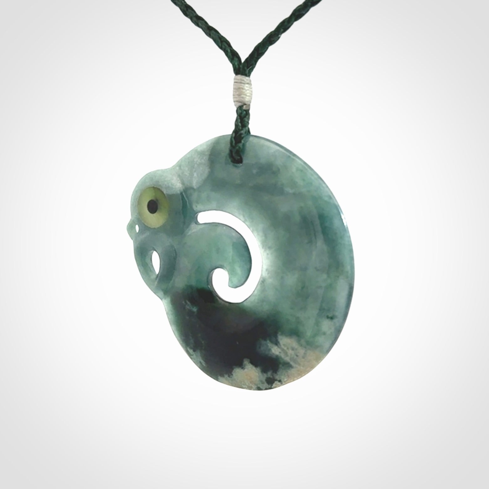 Guatemalan Jadeite Koru Manaia pendant. Made in New Zealand. Real Jade, pounamu. Real New Zealand Jade Manaia with Koru necklace with a polished finish.