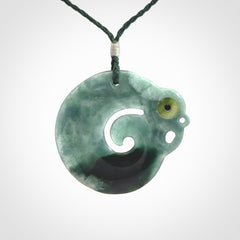 Guatemalan Jadeite Koru Manaia pendant. Made in New Zealand. Real Jade, pounamu. Real New Zealand Jade Manaia with Koru necklace with a polished finish.
