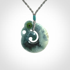 Guatemalan Jadeite Koru Manaia pendant. Made in New Zealand. Real Jade, pounamu. Real New Zealand Jade Manaia with Koru necklace with a polished finish.