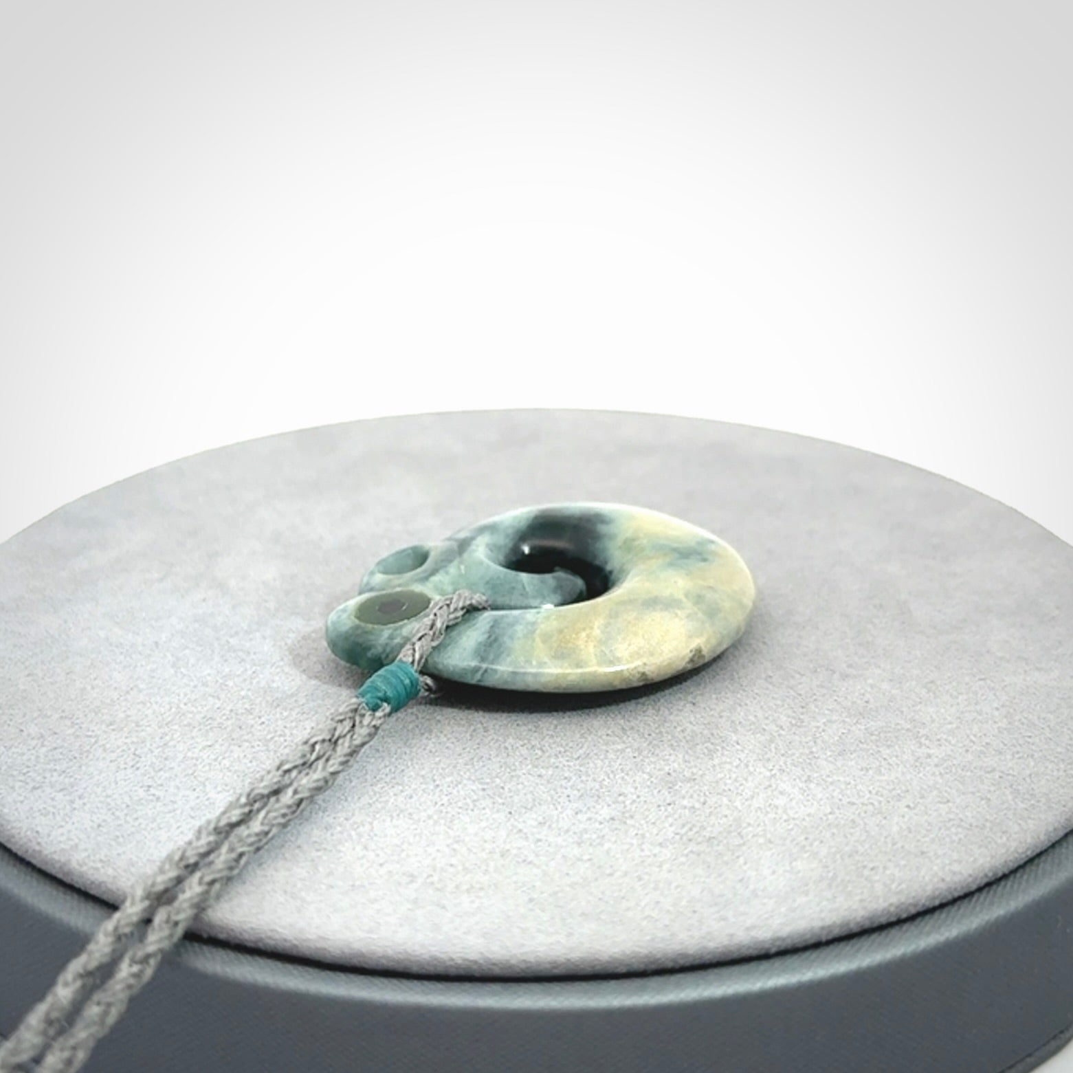 Guatemalan Jadeite Koru Manaia pendant. Made in New Zealand. Real Jade, pounamu. Real New Zealand Jade Manaia with Koru necklace with a polished finish.