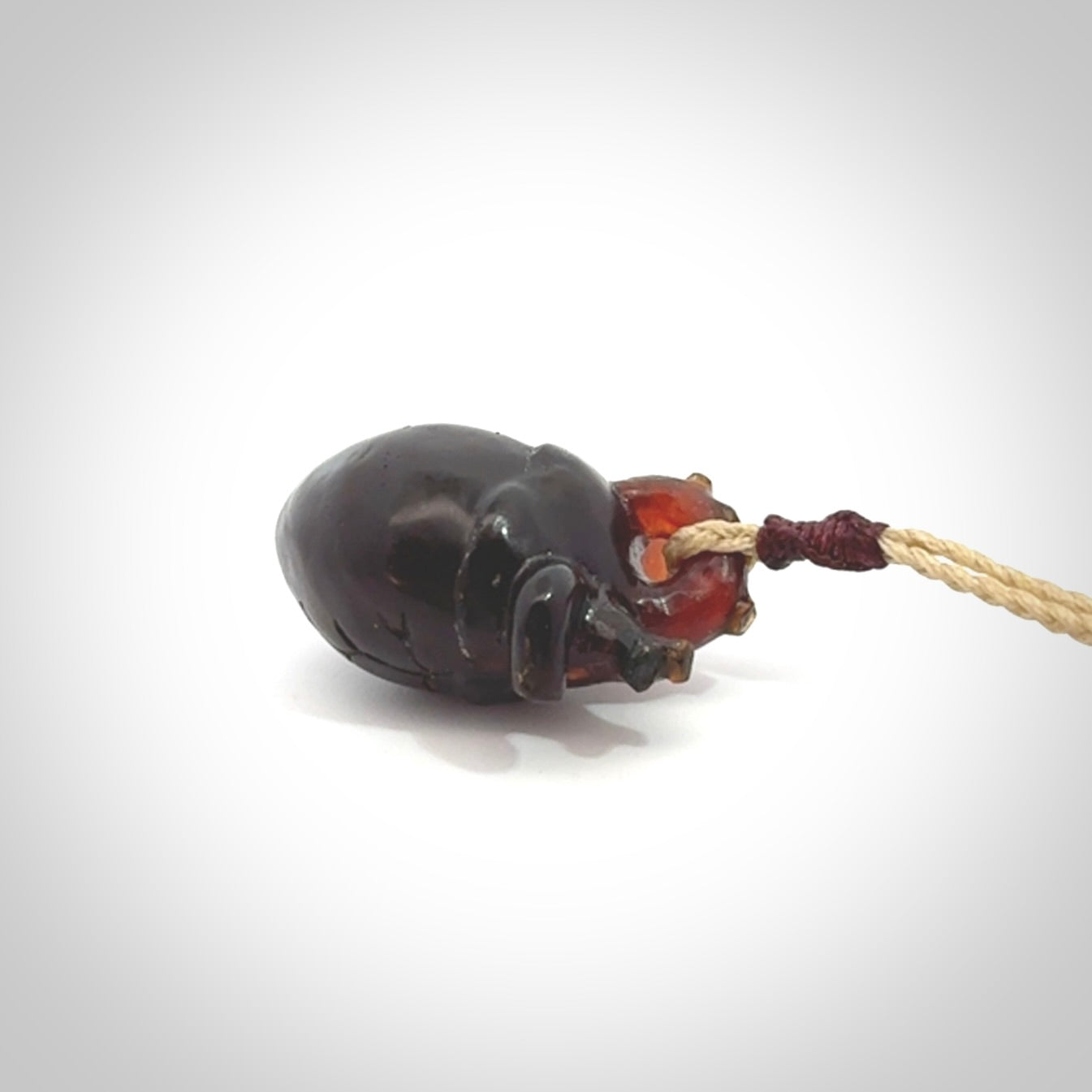 This pendant is handcrafted from rare Amber. It replicates a human heart. It is supplied with an adjustable oat cord.
