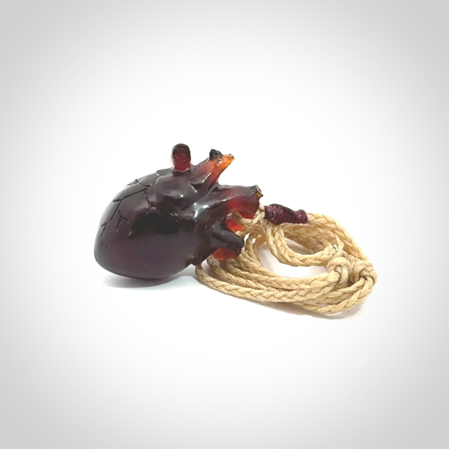 This pendant is handcrafted from rare Amber. It replicates a human heart. It is supplied with an adjustable oat cord.