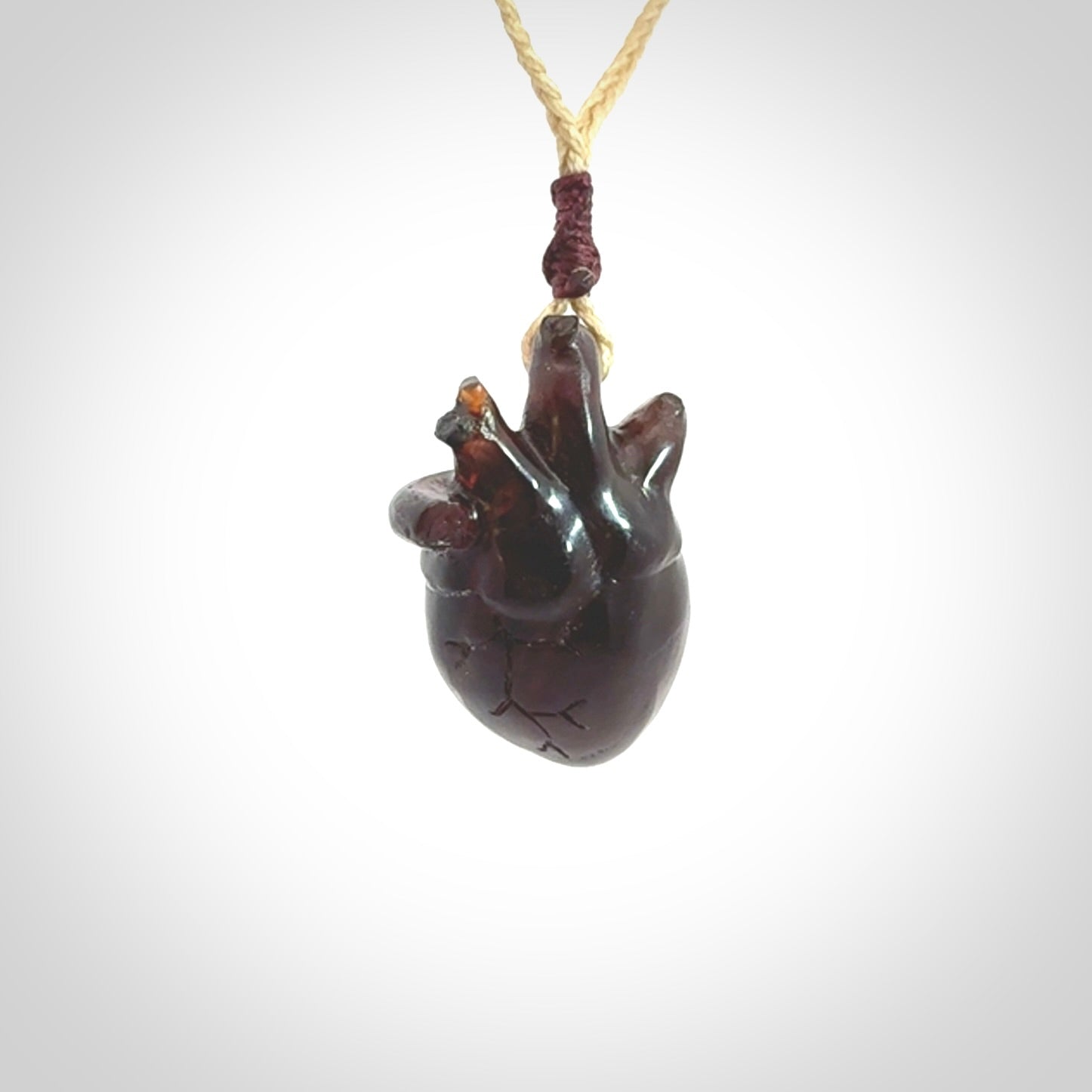 This pendant is handcrafted from rare Amber. It replicates a human heart. It is supplied with an adjustable oat cord.
