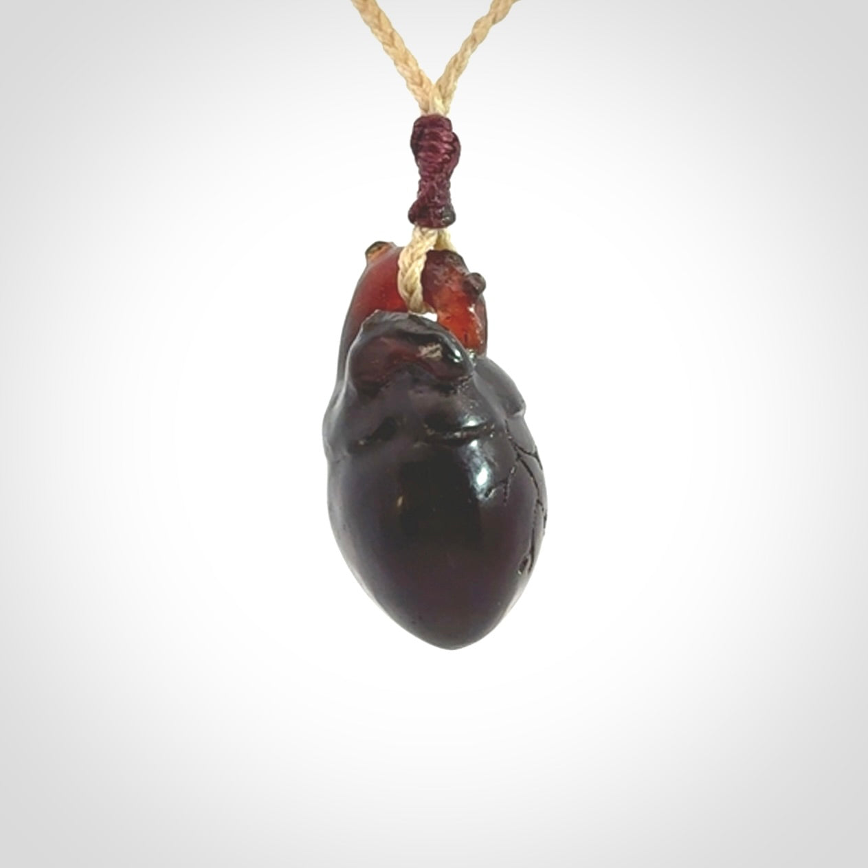 This pendant is handcrafted from rare Amber. It replicates a human heart. It is supplied with an adjustable oat cord.