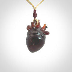 This pendant is handcrafted from rare Amber. It replicates a human heart. It is supplied with an adjustable oat cord.
