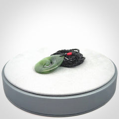 Hand carved New Zealand jade koru drop pendant. Made by NZ Pacific.Hand carved New Zealand jade koru drop pendant. Made by NZ Pacific.