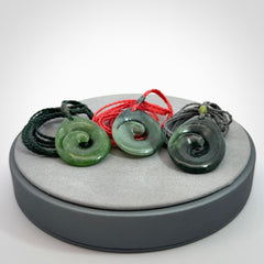 Hand carved New Zealand jade koru drop pendant. Made by NZ Pacific.Hand carved New Zealand jade koru drop pendant. Made by NZ Pacific.