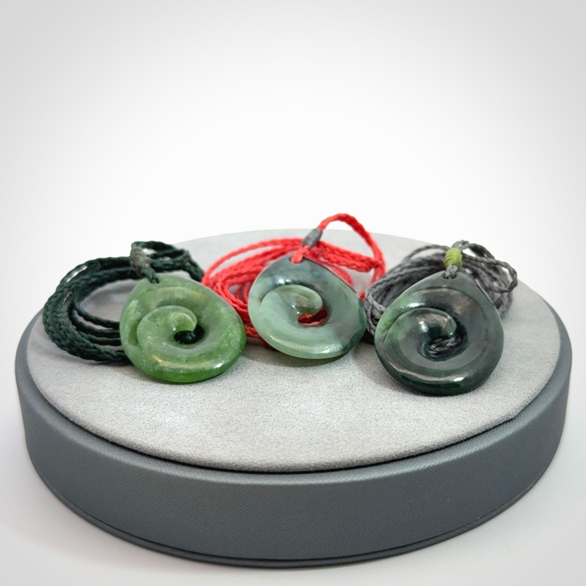 Hand carved New Zealand jade koru drop pendant. Made by NZ Pacific.Hand carved New Zealand jade koru drop pendant. Made by NZ Pacific.