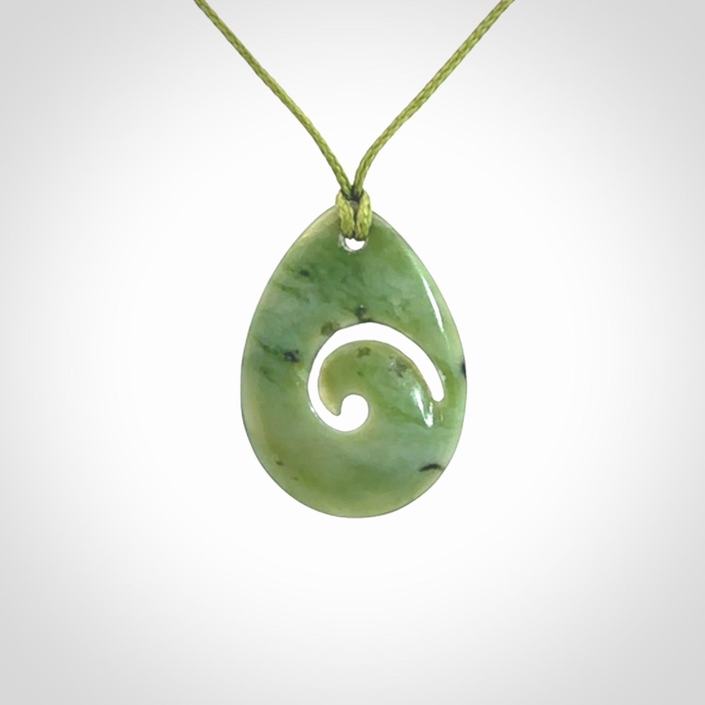 Hand carved New Zealand Jade koru drop pendants