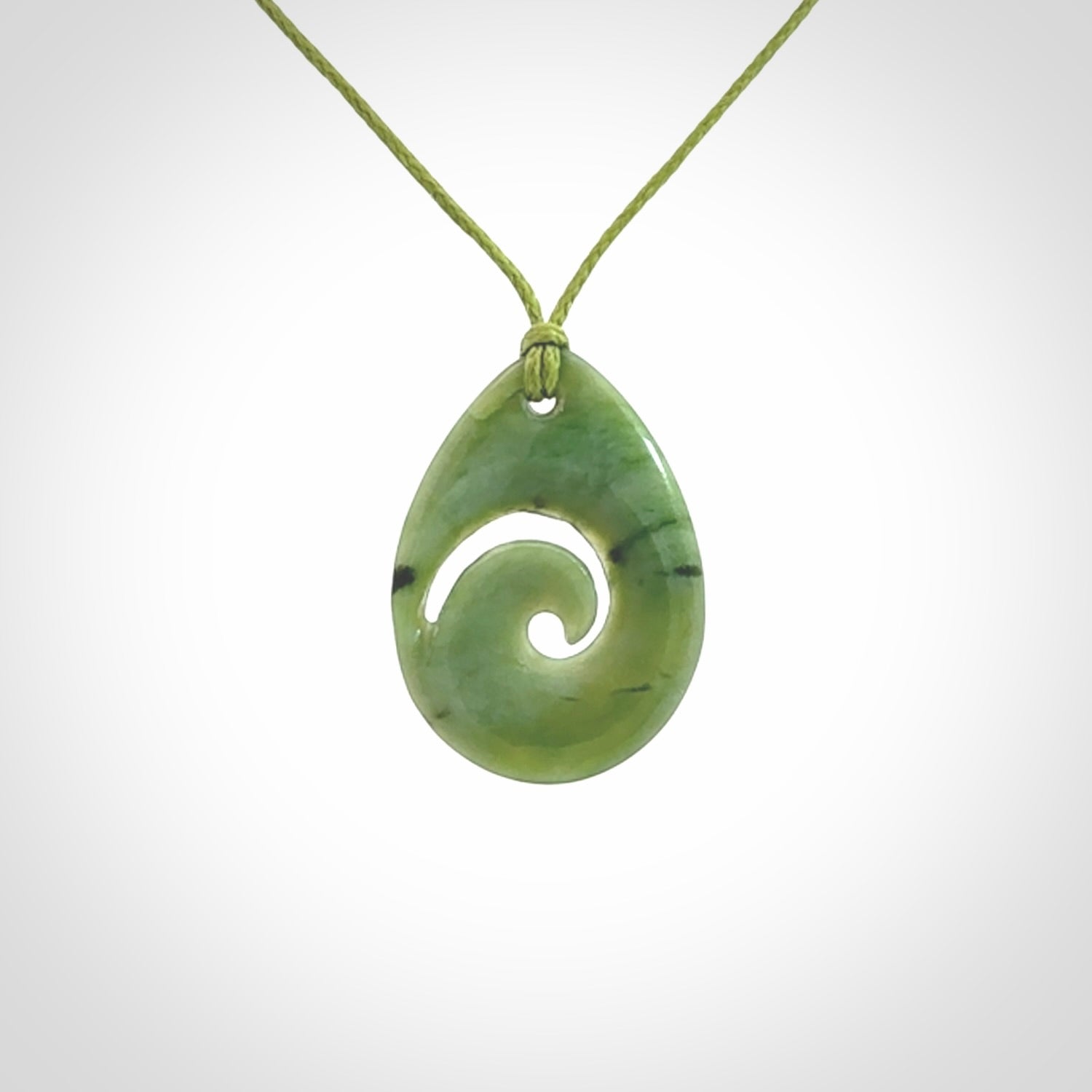 Hand carved New Zealand Jade koru drop pendants