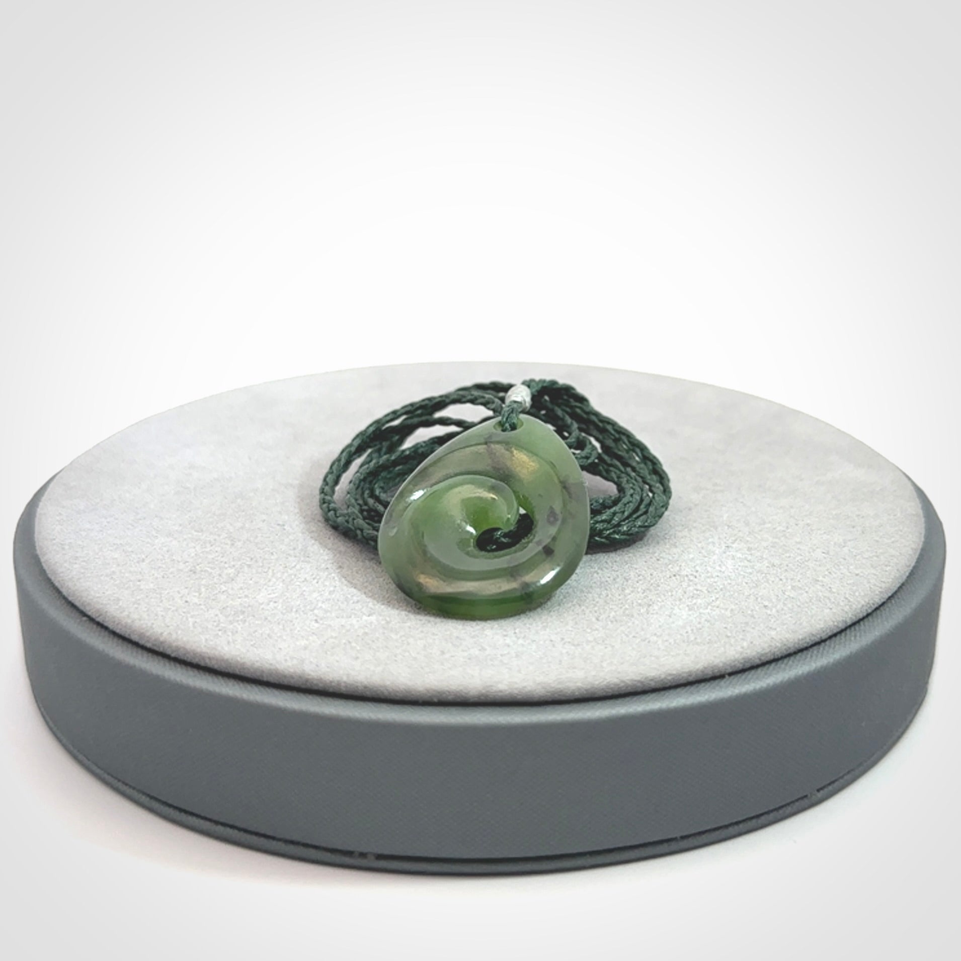 Hand carved New Zealand Jade koru drop pendants
