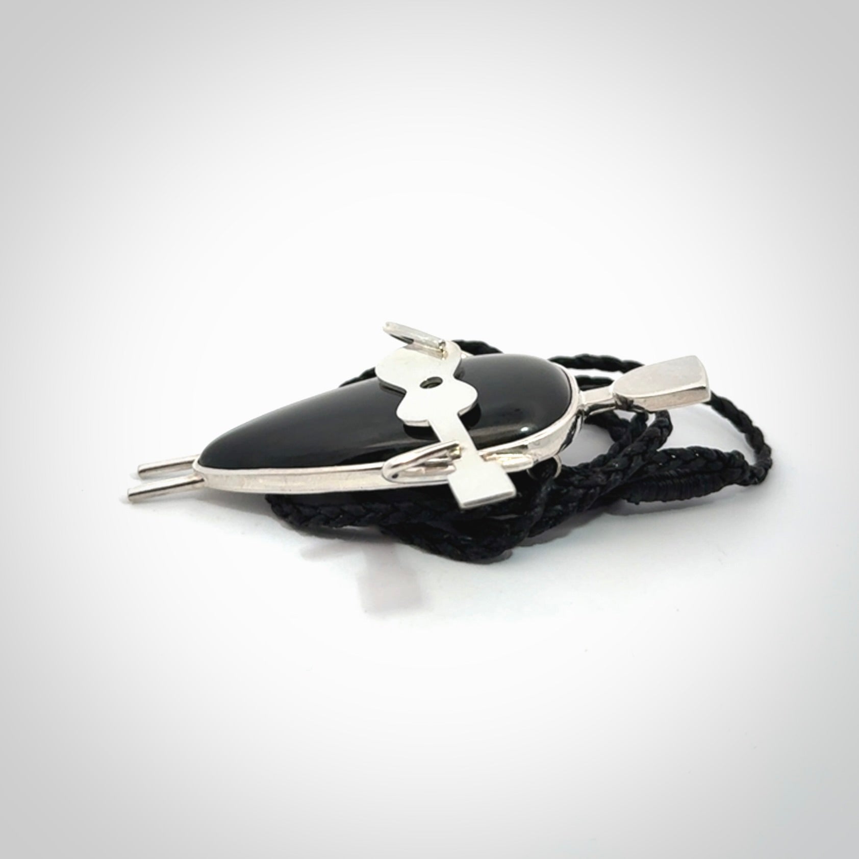 This is a very cool and creative guitarist hand made from Australian Black Jade and Sterling Silver. A guitar playing person hand crafted from sterling silver with Black Jade torso. A spectacular piece of art to wear.
