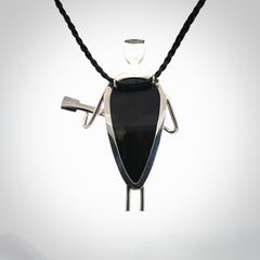 This is a very cool and creative guitarist hand made from Australian Black Jade and Sterling Silver. A guitar playing person hand crafted from sterling silver with Black Jade torso. A spectacular piece of art to wear.