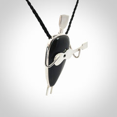 This is a very cool and creative guitarist hand made from Australian Black Jade and Sterling Silver. A guitar playing person hand crafted from sterling silver with Black Jade torso. A spectacular piece of art to wear.