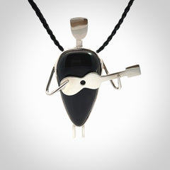 This is a very cool and creative guitarist hand made from Australian Black Jade and Sterling Silver. A guitar playing person hand crafted from sterling silver with Black Jade torso. A spectacular piece of art to wear.